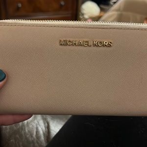 Michael Kors dusty rose zip around wallet.